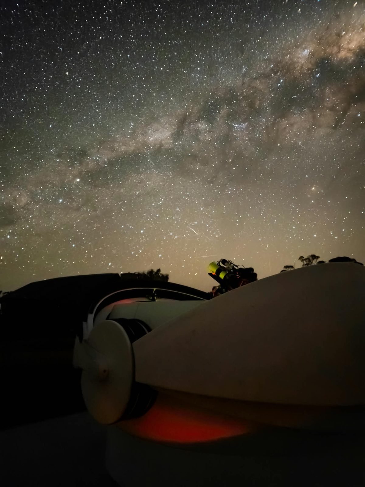 Clamshell observatory at Nebula Nest under the Milky Way at night